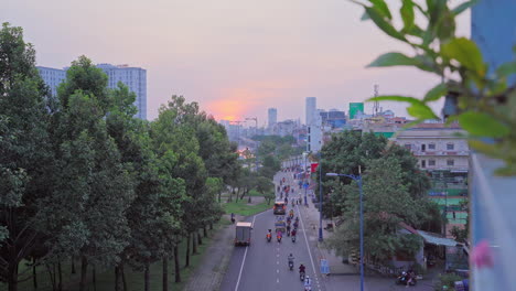 Busy-cars-with-traffic-in-the-rush-hour-on-highway-road-street-on-sunset-in-Ho-Chi-Minh-Downtown,-urban-city-in-Asia,-Vietnam