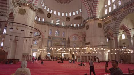 Wide-Carpeted-Floor-With-Stained-Glass-Windows-Inside-The-Blue-Mosque-In-Istanbul,-Turkey