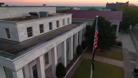 USA-flag-and-historic-post-office-and-court-house-building