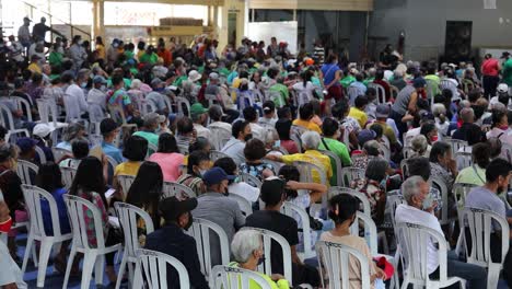 people-in-different-areas-wait-in-groups-or-a-crowd-sitting-calmly-waiting