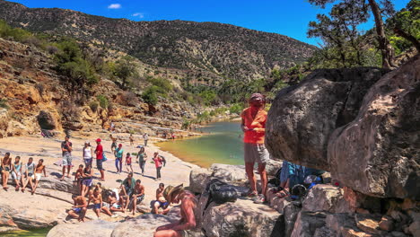 Tourists-enjoy-the-oasis-at-Paradise-Valley-near-Agadir,-Morocco---time-lapse