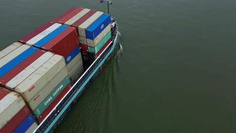 Aerial-Overhead-View-Of-Tripoli-Cargo-Ship-Navigating-Oude-Maas-With-Descending-Shot-Off-Starboard-Side