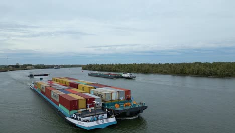 Aerial-View-Off-Forward-Bow-Of-Sento-Cargo-Ship-Paired-With-Barge-Travelling-Along-Oude-Maas-Through-Puttershoek