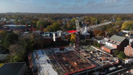 Urban-city-skyscraper-construction-with-crane.-Aerial-obit