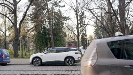 Static-shot-of-a-plug-in-electric-car-parked-in-the-street-in-daylight