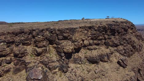 Drone-shot-of-the-Fish-River-Canyon-in-Namibia---drone-is-ascending-and-revealing-the-beautiful-African-canyon