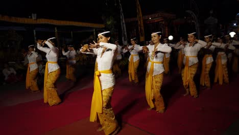 Females-performing-at-ancient-Hindu-temple,-Traditional-Artistic-Dance-clearer-view-into-the-spiritual-world-Bali-Indonesia-travel-and-tourism