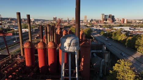 Rising-aerial-of-Sloss-Furnaces-reveals-downtown-Birmingham-Alabama-skyline