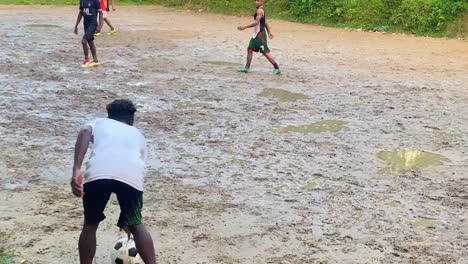 Men-playing-football-in-tragic-conditions