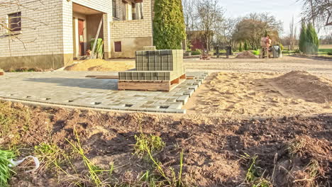 Time-lapse-shot-of-many-worker-Laying-Pavement-in-residential-apartment