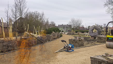 Grading-and-landscaping-a-pathway-in-a-public-park-in-Jelgave,-Latvia---time-lapse