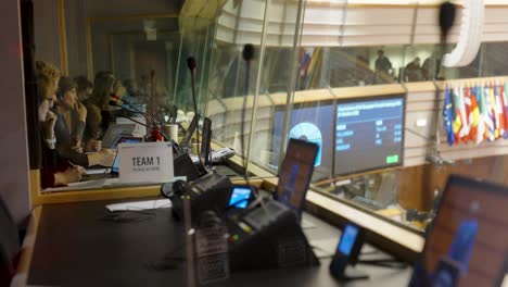 Group-of-interpreters-translating-speeches-during-the-plenary-session-at-the-European-Parliament-in-Brussels,-Belgium