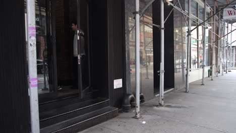 Freelancer-Greeting-Friend-At-Store-And-Walking-Inside-In-New-York