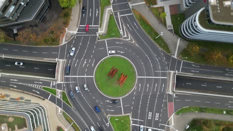 A-rotating-aerial-view-of-the-iconic-Helmut-Schmidt-Platz-on-the-B9-road-in-Bonn,-Germany,-showing-the-ARC'89-sculpture-by-Bernar-Venet