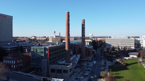 Reverse-Aerial-of-RJR-Tobacco-towers-in-Winston-Salem,-NC