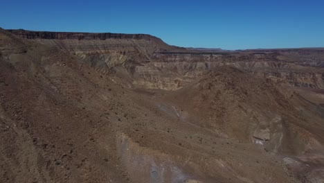 Drone-shot-of-the-Fish-River-Canyon-in-Namibia---drone-is-flying-through-the-African-canyon