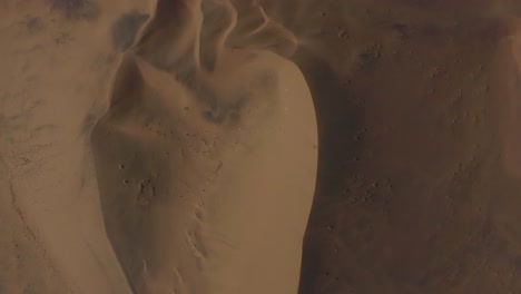 Drone-shot-of-the-Namib-desert-in-Namibia---drone-is-flying-over-the-lonely-desert-and-dry-dunes-in-birds-eye-view