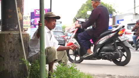 Poor-man-on-the-side-of-the-road