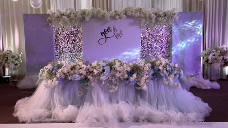 Beautifully-decorated-wedding-table-with-artificial-flowers-and-illuminated