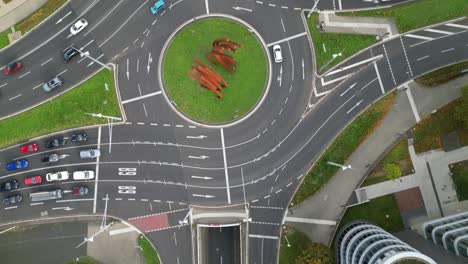 A-fly-over-aerial-view-of-the-iconic-Helmut-Schmidt-Platz-on-the-B9-road-in-Bonn,-Germany,-showing-the-ARC'89-sculpture-by-Bernar-Venet