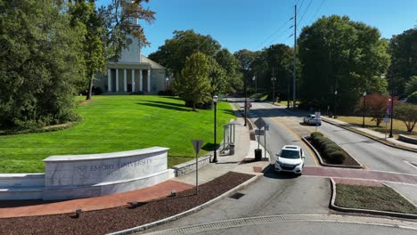 Emory-University-sign-and-Methodist-church-on-college-campus