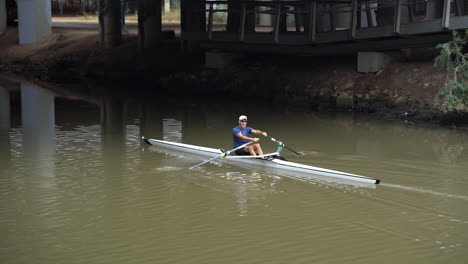 Tel-Aviv-Israel-Nov-22:-Man-Kayaking-at-haYarkon-river-under-Bird-Head-Bridge-in-Tel-Aviv,-Israel