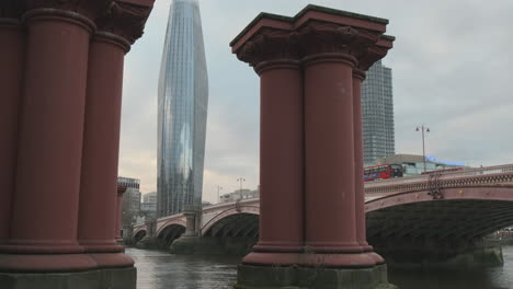 Blackfriars-Bridge-before-Restoration-with-One-Blackfriars-aka-Boomerang-Building,-Between-Old-Bridge-Pillars,-Columns