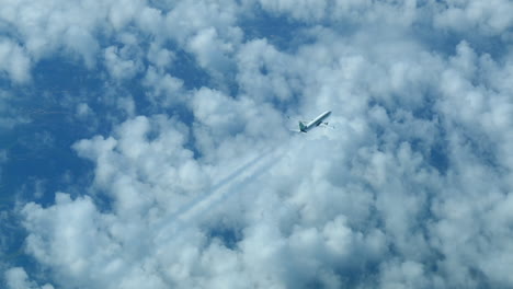 Passenger-Airplane-Flying-Above-The-Clouds,-Looking-Down-From-Cockpit