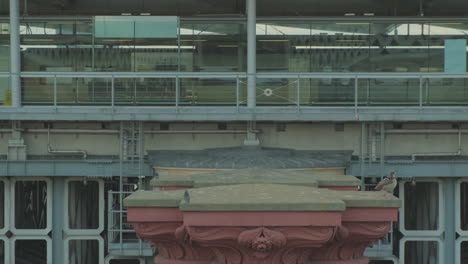 Train-Departing-London-Blackfriars-Station,-View-from-Blackfriars-Bridge-With-Old-Red-Pillars-in-Foreground