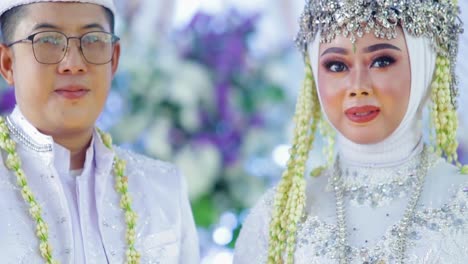 Bride-and-Groom-holding-buku-nikah-or-marriage-book