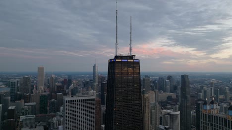 John-Hancock-building-gloomy-evening-in-Chicago,-USA---Aerial-view