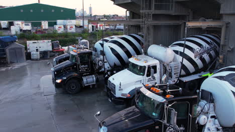 Brooklyn-NYC-USA,-Drone-Shot-of-Heavy-Trucks-at-Loading-Station-of-Concrete-Ready-Mix-Plant-60fps