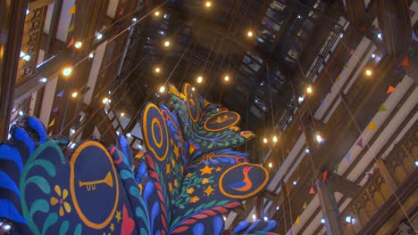 Colorful-Christmas-Tree-And-Interior-Lights-Inside-The-Famous-Liberty-Department-Store-In-London,-UK