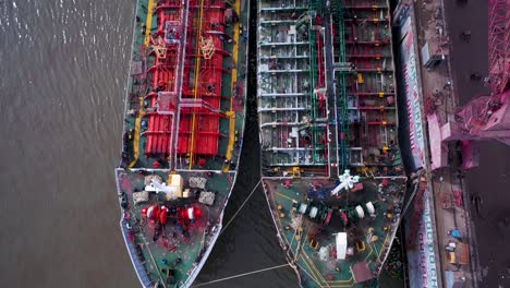 Shipyard-and-dry-dock-facility-Saigon-river-Vietnam-tracking-shot-over-large-tankers-being-repaired