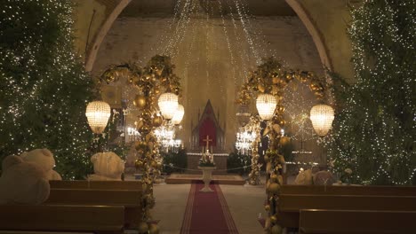 Ropazi-Lutheran-Church,-Latvia-December-3,-2022:-Light-Garden-in-Ropazi-Evangelical-Lutheran-Church-in-Advent-Time,-Christmas-Decor-of-Lights-With-Various-Figures-and-Teddy-Bears,-Festive-Atmosphere