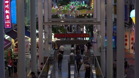 Top-view-of-passengers-exiting-and-entering-Chinatown-MRT-Station-in-Singapore