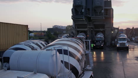 Heavy-Mixer-Concrete-Trucks-at-Loading-Station-in-Ready-Mix-Plant,-Brooklyn-NYC-USA