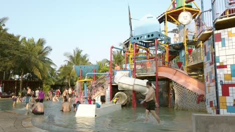 Families-playing-and-swimming-at-a-public-pool