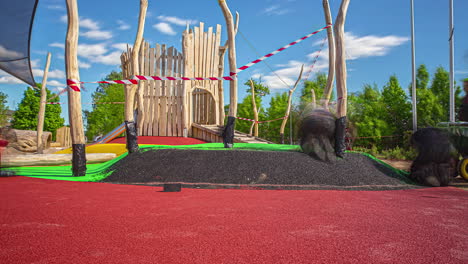 Close-up-shot-of-workers-busy-rubber-flooring-throughout-the-day-in-a-playground-on-a-cloudy-day-in-timelapse