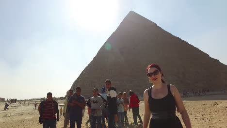 Camera-following-a-girl-who-is-running-away-after-kids-took-selfies-with-her-next-to-the-Khafre-pyramid-in-Egypt