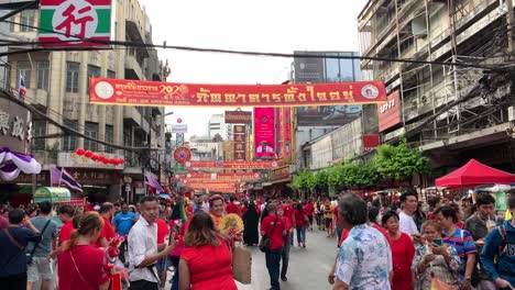 People-in-street-of-Bangkok-celebrating-and-festoon-hanging