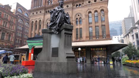 Sydney-landmark-in-heavy-rain,-QVB,-locked-down-low-wide-angle