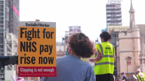 NHS-worker-giving-a-speech-at-a-protest