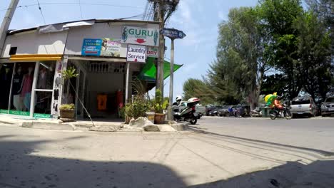 A-Time-lapse-showing-movement-of-transport-and-people-on-beach-road-Cha-am