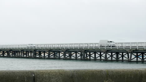 Traffic-crossing-the-historic-Barwon-Heads-bridge,-Victoria-Australia