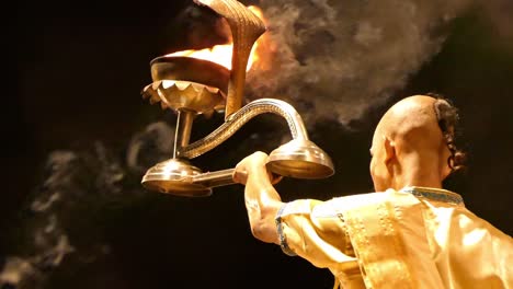 Close-Up-portrays-of-Indian-Yogis-doing-Ganga-Aarti-in-Varanasi,-India