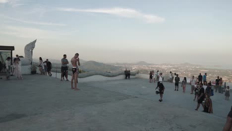 Behind-the-Scenes-of-a-music-video-production-at-the-landmark-Big-Buddha-Phuket,-Thailand----Steadyshot-from-side----Kickboxing-world-champion-showing-off-his-skills----Shadow-fighting