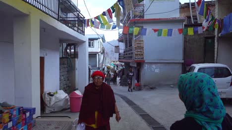 Locals-Walking-In-The-Street-Of-Kaza-In-The-District-Of-Spiti,-Himachal-Pradesh,-India