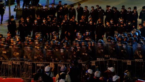 Police-Line---Policemen-With-Riot-Shields-Blocking-The-Street-During-Rally-In-Bangkok,-Thailand-Amidst-The-Pandemic