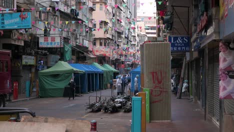 Chinese-health-workers-dressed-in-PEE-suits-are-seen-inside-an-area-under-lockdown-to-contain-the-spread-of-the-Coronavirus-variant-outbreak